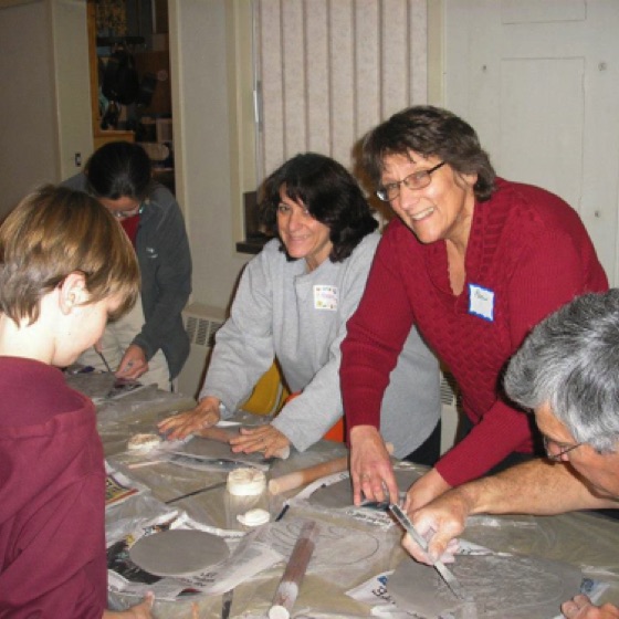Our happy volunteers seem pretty psyched to be playing with the clay