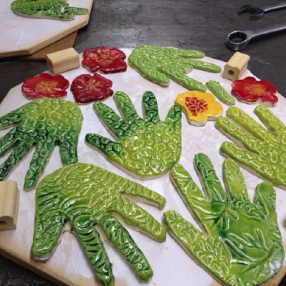 Before firing, the pieces were a bit dull.  Afterwards they are bright and gleaming!
Photo courtesy of Nancy Quickert Bertolini